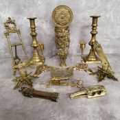 A pair of 19th century brass candlesticks the bases in the form of butterflies; a pair brass ejector
