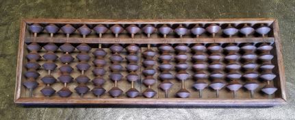 An early 20th century Chinese padouk wood abacus 33cm wide