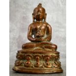 A very early Chinese shrine bronze deity showing signs of gilt 10cm high