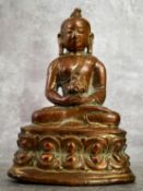 A very early Chinese shrine bronze deity showing signs of gilt 10cm high