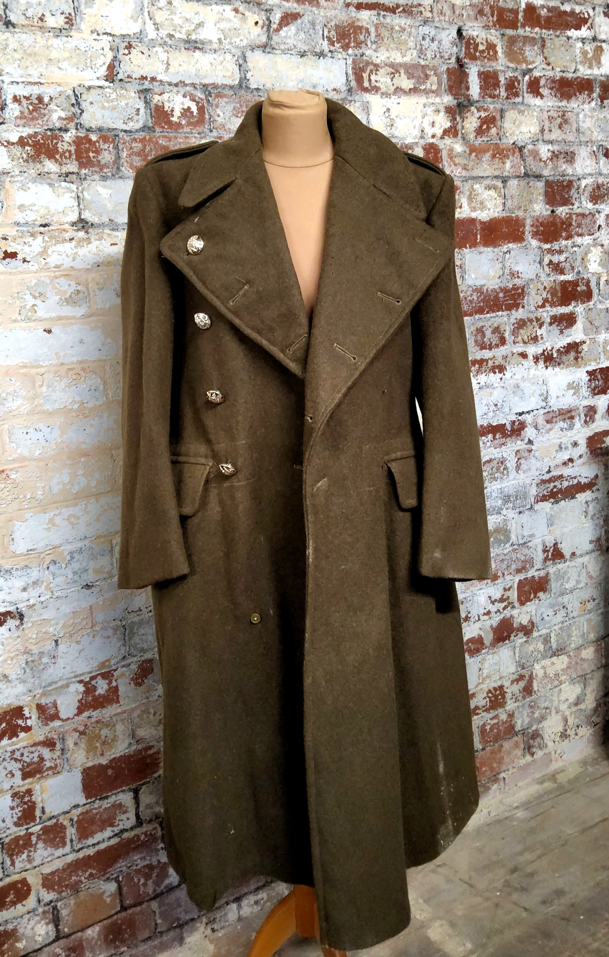 A military Greatcoat, Stone Bros, size 5, broad arrow markings