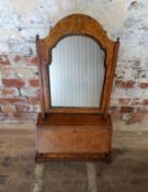A George II feather banded burr walnut dressing table mirror, fall front housing six drawers  Height