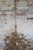A Dutch style brass 12 branch chandelier Height 70cm x dia 75cm, (total height with chain 133cm)