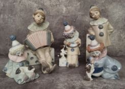 Five Lladro clown figures including Girl with Domino, No. 1175; Boy with Accordion on Domino, No.