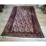 A large early 20th century hand knotted Middle Eastern / Caucasian rectangular carpet, bold