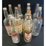 Advertisement- nine large 4.5l whisky bottles, including Bells, Grants, Hankey Bannister, one