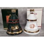 Two Bell's Old Scotch Whisky Christmas bell shaped decanters produced by Wade, the green bell shaped