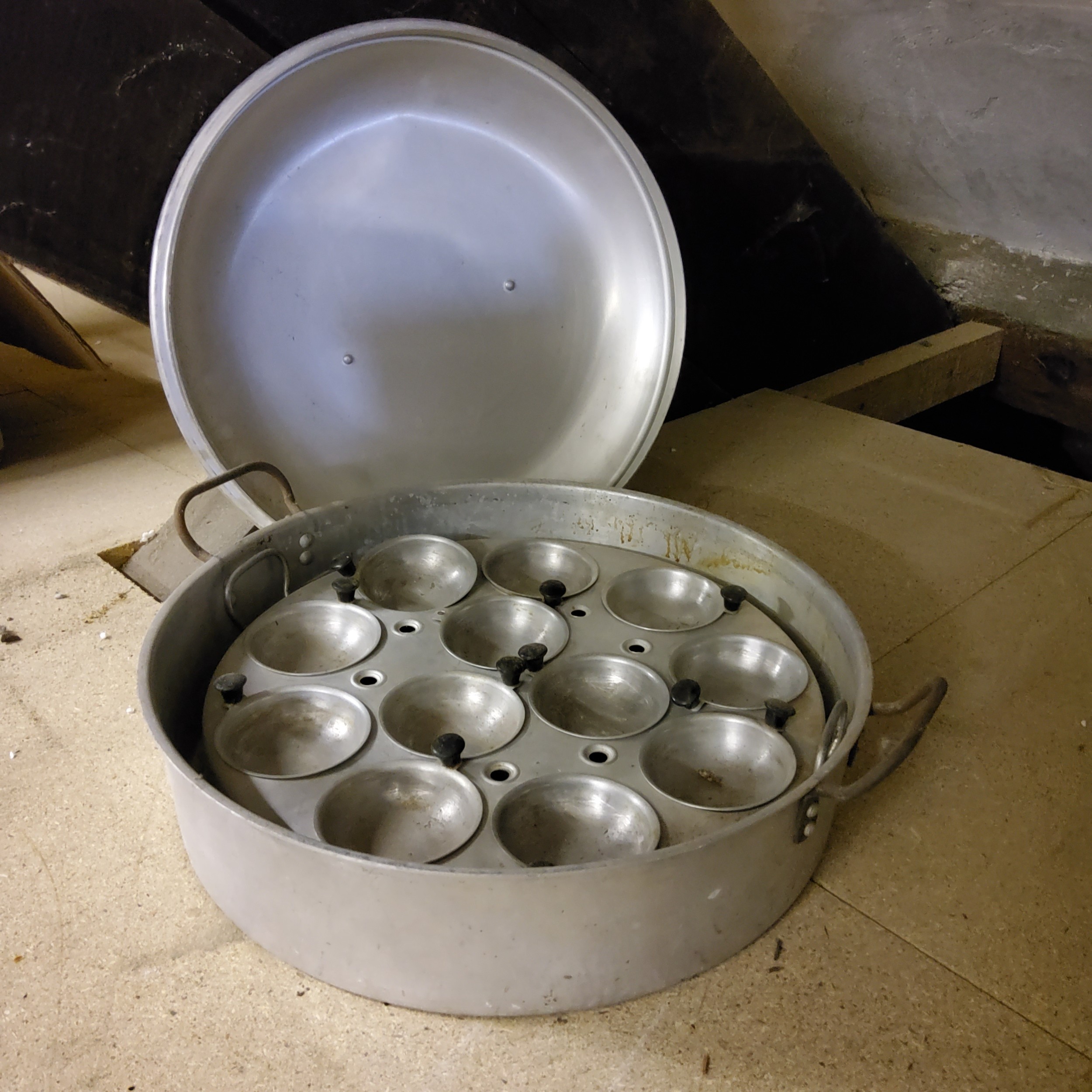 Kitchenalia - a substantial twelve egg poaching pan and cover 40cm diameter x 13cm H