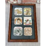 Advertising - a framed display of six cigar labels 48cm heigh x 31cm wide