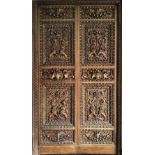 A pair of French 19th century Napoleon III style Chateau internal carved walnut double doors