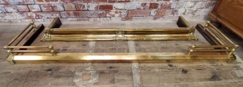 A pair of early 20th century brass fire surrounds
