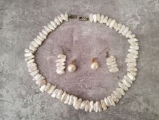 An impressive single strand of seventy one large white, pink and peach baroque pearl necklace; a