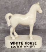 Advertising a vintage White Horse Whisky chalkware bar display horse, brand name embossed in