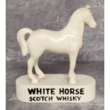 Advertising a vintage White Horse Whisky chalkware bar display horse, brand name embossed in