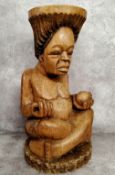 Tribal - a substantial African offertory bowl carved as a seated woman, she sits 45cm high