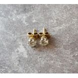 Pair of round brilliant-cut diamond ear studs, claw set yellow & white metal mounts, approx. 0.