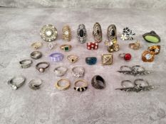 A jewellery box full of fashion rings, including silver and stone inset examples, yellow metal, gold