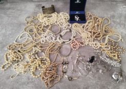 A box of natural pearl necklaces; faux pearl necklaces; Swarovski jewellery; and other jewellery