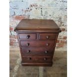 A Victorian apprentice piece chest of two short above three graduated drawers. H. 56.5cm x W. 44cm x