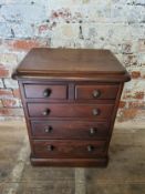 A Victorian apprentice piece chest of two short above three graduated drawers. H. 56.5cm x W. 44cm x