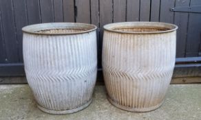 A pair of galvanised dolly tubs, pierced bases for garden planter use