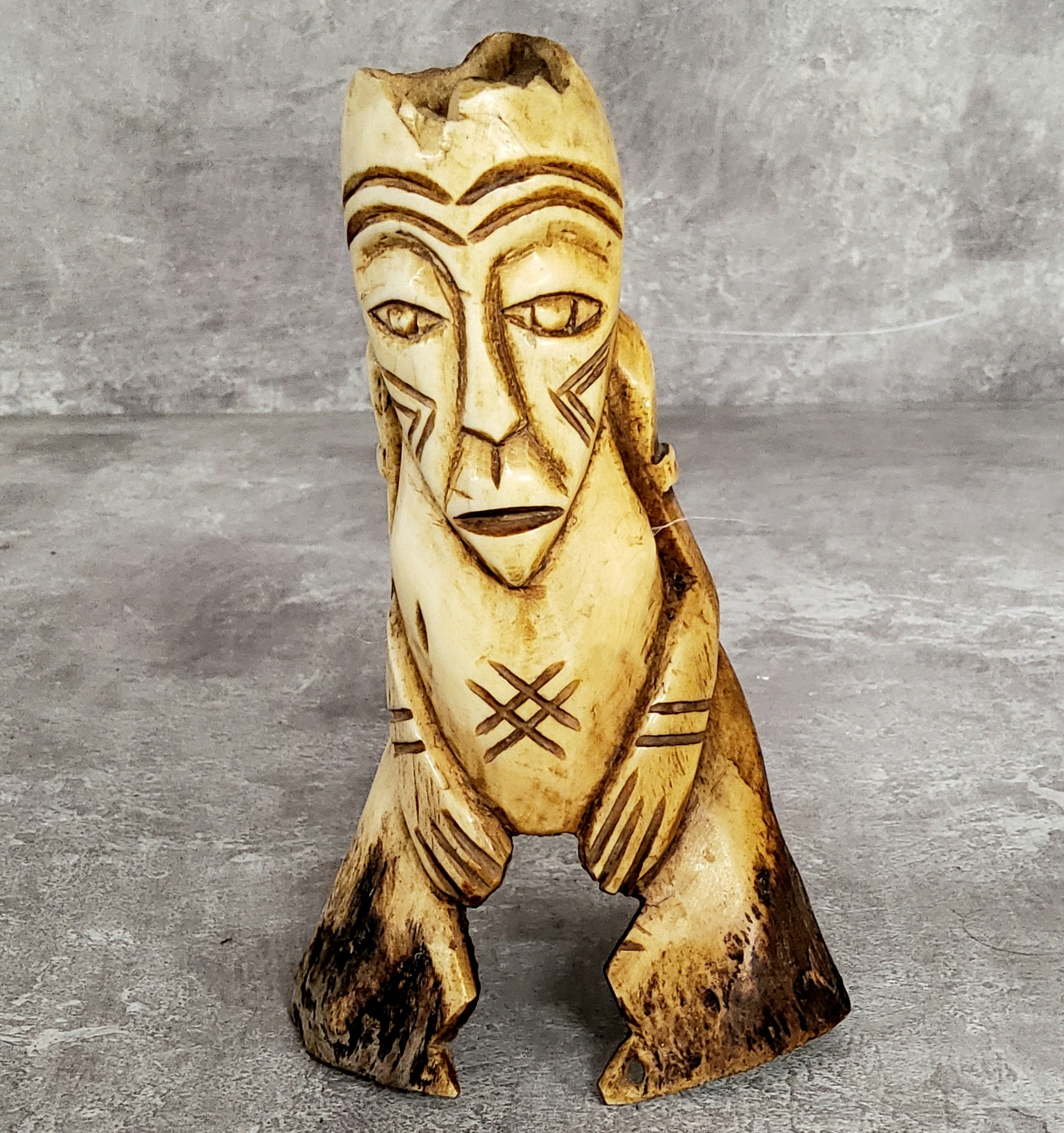 Amended Description an African leg bone carving, 15cm high