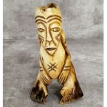 Amended Description an African leg bone carving, 15cm high