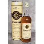 A bottle of AUCHENTOSHAN 10 year triple distilled Lowland single malt Scotch whisky, distilled and