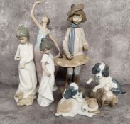 NAO by Lladro figures including 'The Dance is Over'; Young Artist (af); Puppies Playing; another