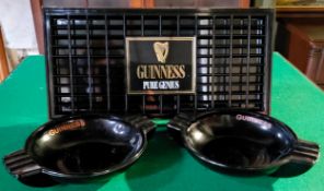 Guinness - Mint condition drip tray and a pair of large black glass advertisement ashtrays made by