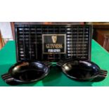 Guinness - Mint condition drip tray and a pair of large black glass advertisement ashtrays made by