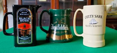 A Glenfiddich whisky water jug; Black Bush Irish Whiskey and a Cuttysark Scots whisky jug (3)