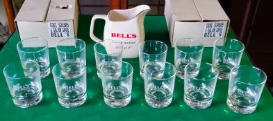A Bell's whisky water jug by Wade and twelve weighted Bell's whisky '8 year' tumblers (13) Excellent