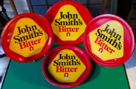 Four John Smith's Bitter serving trays. Excellent Condition.