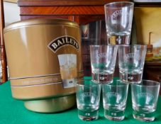 A large Baileys ice bucket with six Baileys glasses. Excellent Condition.