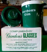 A Gordon's Gin ice bucket and twelve Gordon's Gin glasses (13)