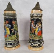 A pair of West Germany steins with covers, decorated in relief, 1.5 litres, marks to base, 36cm