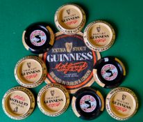 Advertisement - Nine MINT condition Guinness metal ashtrays and a vintage Guinness circular bar