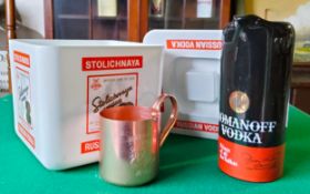 A Stolichnaya Russian Vodka ice bucket; Smirnoff Mule copper tankard; a Wade Romanoff Vodka '