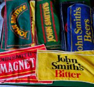 Variety of John Smith's Brewery related beer towels, different styles of design.