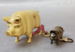 A Victorian novelty brass needlework tape measure, modelled as a pig; an early 20th century