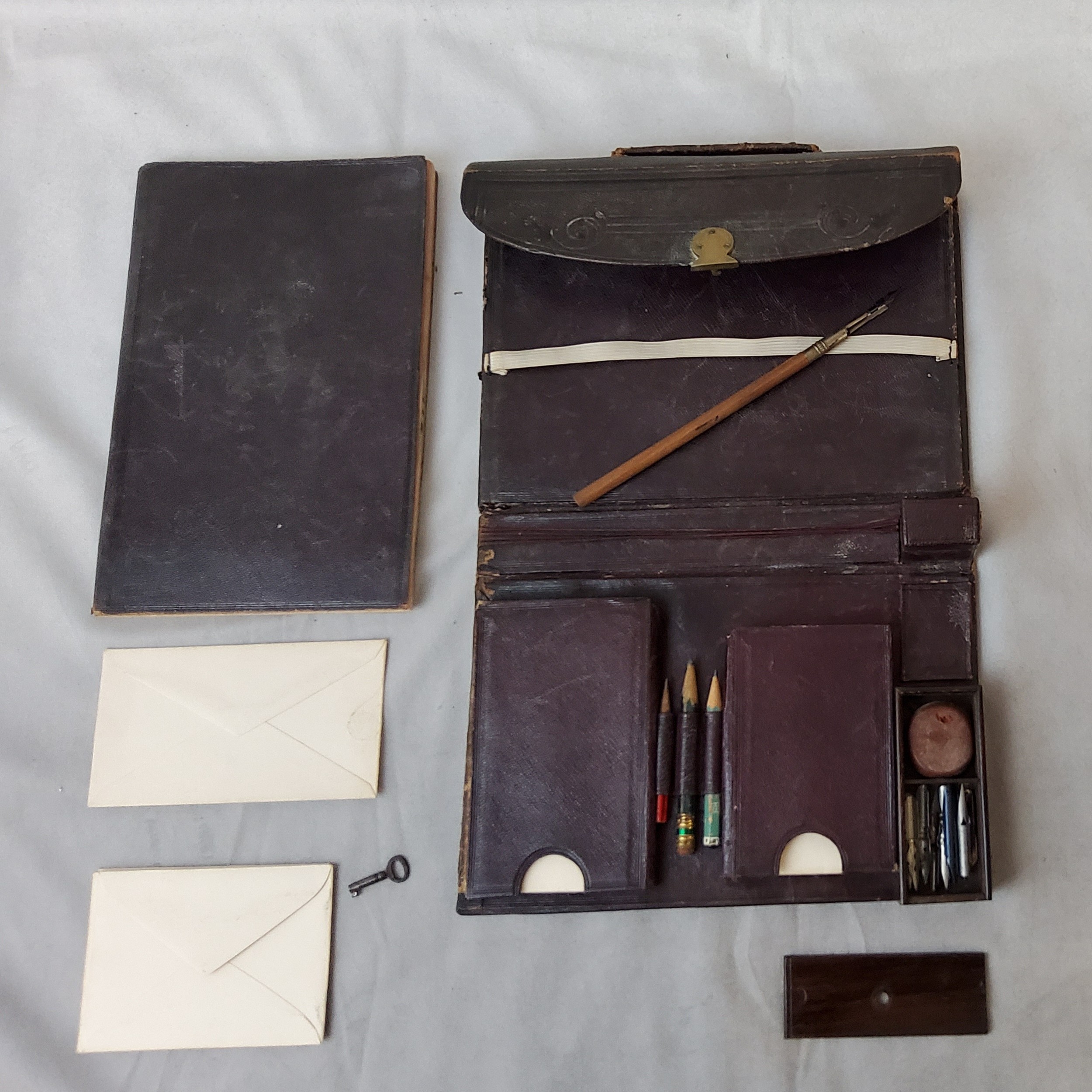 A Victorian Moroccan leather novelty travelling aide memoire in the form of a briefcase circa