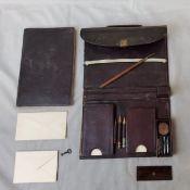 A Victorian Moroccan leather novelty travelling aide memoire in the form of a briefcase circa