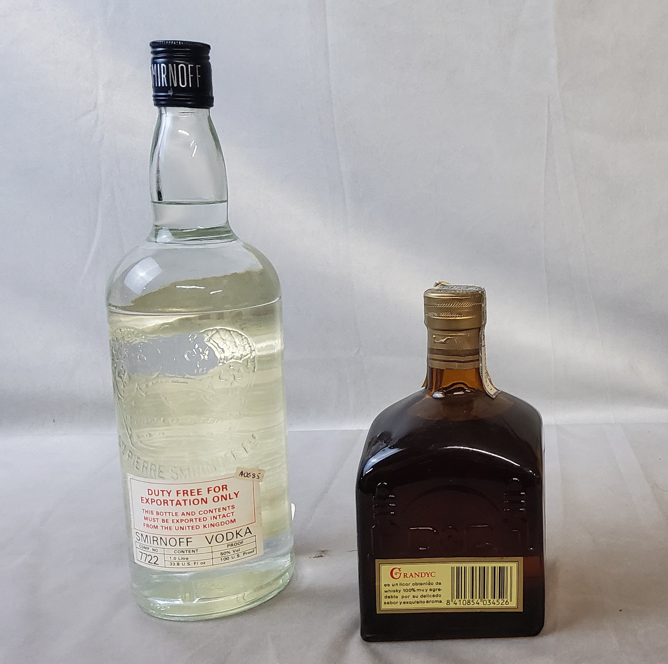 Smirnoff export vodka, 1 litre, sealed, 50% vol, post stickered Aug 85 ; Grandyc Licor de Whisky, - Image 2 of 2