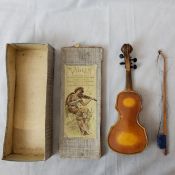 A scarce Toyodaya Co. Tokyo, tinplate violin complete with bow, in original box