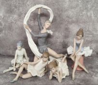 A Nao figure, of a ballerina with ribbon, 34cm high, a ballerina seated; other ballerinas