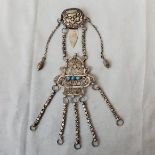 A Mexican inspired white metal filigree chatelaine clip with turquoise inset details and filigree
