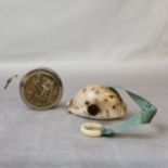 A 19th century conch shell needlework tape measure; another early 20th century Continental example
