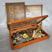 A small counter top bijouterie cabinet with contents of picture hooks, William Morris book,etc