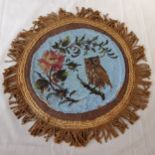 A Victorian beadwork and textile place mat decorated with flowers and an owl c.1860. 36cm diameter